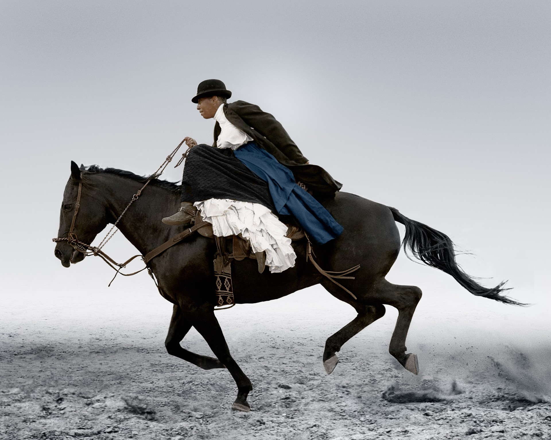 Black woman riding a black horse